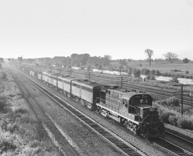 New York Central Railroad diesel locomotive no. 2040 leads a westbound coal train in Wayneport, New York, on September 1, 1967. Photograph by Victor Hand. Hand-NYC-PC-CR-31-0055