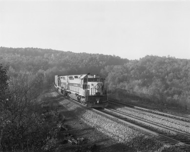 Erie Lackawanna Railway diesel locomotive no. 3656 hauls westbound freight in Nicholson, Pennsylvania, on October 4, 1975; Photograph by Victor Hand. Hand-EL-30-184