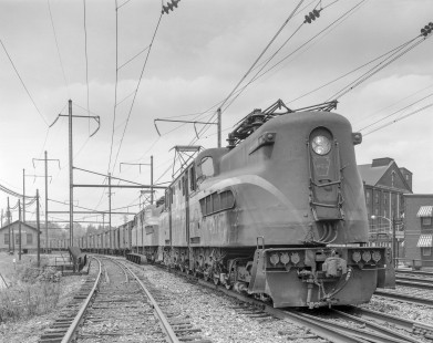 Penn Central GG1 electric locomotive no. 4879, still wearing the paint of predecessor Pennsylvania Railroad, hauls an eastbound reefer train in Middletown, Pennsylvania, on May 18, 1969. Photograph by Victor Hand. Hand-NYC-PC-CR-31-0221.JPG