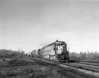 Erie Lackawanna Railway diesel locomotive no. 3674, hauls freight (pool train with Central Railway of New Jersey) at Gouldsboro, Pennsylvania, on October 26, 1974;  Photograph by Victor Hand. Hand-EL-30-181.