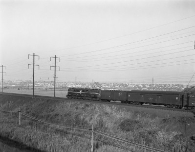 Pennsylvania Railroad GG1 electric locomotive no. 4863 leads  eastbound passenger train no. 132, the <i>Representative, </i> near the Snake Hill area in Secaucus, New Jersey, on July 21, 1965. Photograph by Victor Hand. Hand-PRR-32-053
