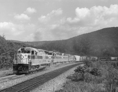 Erie Lackawanna Railroad diesel locomotive no. 2254 leads a consist a four units at the head of an eastbound freight train near Lanesboro, Pennsylvania on August 29, 1967; Photograph by Victor Hand; Hand-EL-30-140
