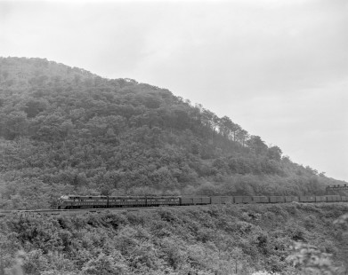 Pennsylvania Railroad diesel locomotive no. 5867 and two mates haul a mail train near Horseshoe Curve in Pennsylvania, on June 7, 1963. Photograph by Victor Hand. Hand-PRR-32-015