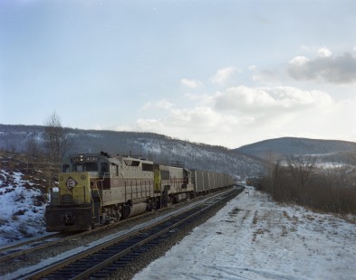 Erie Lackawanna diesel locomotive no. 2574 leads eastbound freight near Lanesboro, Pennsylvania on January 21, 1968; Photograph by Victor Hand; Hand-EL-C30-016.