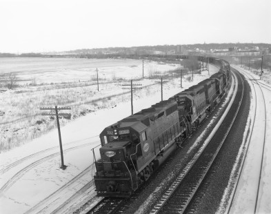 New York Central Railroad diesel locomotive no. 3062 leads westbound freight train in Syracuse, New York, on February 19, 1968. Photograph by Victor Hand. Hand-NYC-PC-CR-31-0121