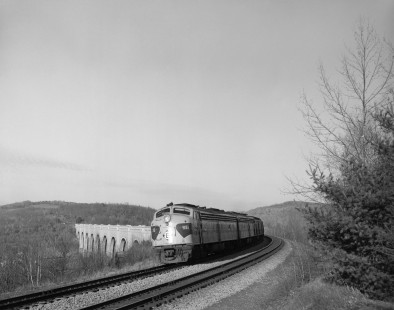 Erie Lackawanna Railroad locomotive no. 830 leads eastbound passenger train no. 2, the "Phoebe Snow" at Nicholson, Pennsylvania on November 14, 1966. The Tunkhannock Viaduct is visible behind the train. Photograph by Victor Hand. Hand-EL-30-116.JPG