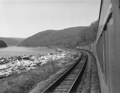 Pennsylvania Railroad locomotive nos. 5765 and 5885 lead   westbound passenger train no. 571, the <i>Buffalo Day Express</i>, between Lock Haven and Emporium, Pennsylvania, on March 13, 1965. Photograph by Victor Hand. Hand-PRR-32-040