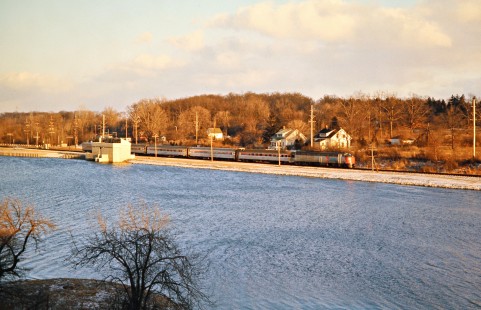 Westbound Amtrak passenger train no. 363, the <i>St. Clair</i>, operating on Penn Central along the Huron River near Ann Arbor, Michigan, on March 24, 1974. Photograph by John F. Bjorklund, © 2016, Center for Railroad Photography and Art. Bjorklund-79-26-01