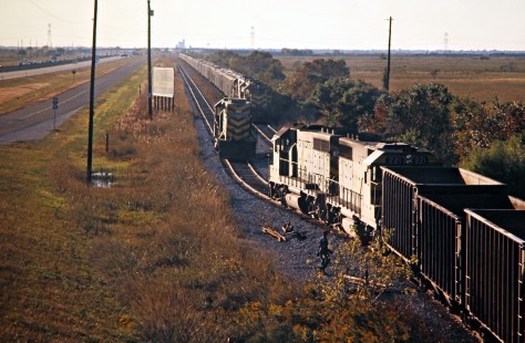 Missouri–Kansas–Texas Railroad freight trains meet and exchange a locomotive at Katy, Texas, on October 31, 1976. Photograph by John F. Bjorklund, © 2016, Center for Railroad Photography and Art. Bjorklund-70-01-03