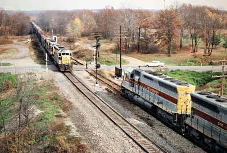 Westbound and eastbound Erie Lackawanna Railway freight trains meet at Amasa Junction near Osgood, Pennsylvania, on October 26, 1975. Photograph by John F. Bjorklund, © 2016, Center for Railroad Photography and Art. Bjorklund-55-18-24