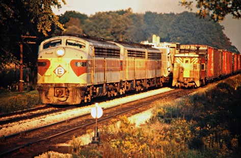Westbound and eastbound Erie Lackawanna Railway freight trains meet on the west side of Lima, Ohio, on September 28, 1975. Photograph by John F. Bjorklund, © 2016, Center for Railroad Photography and Art. Bjorklund-55-12-20