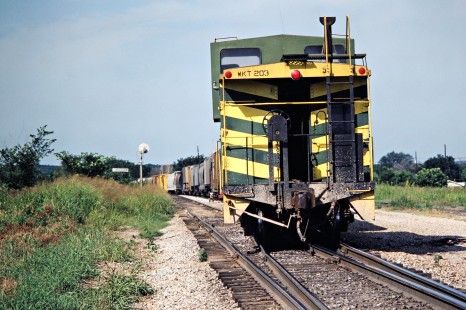 Caboose of a southbound Missouri–Kansas–Texas Railroad freight train in Canadian, Oklahoma, on July 16, 1981. Photograph by John F. Bjorklund, © 2016, Center for Railroad Photography and Art. Bjorklund-70-13-01