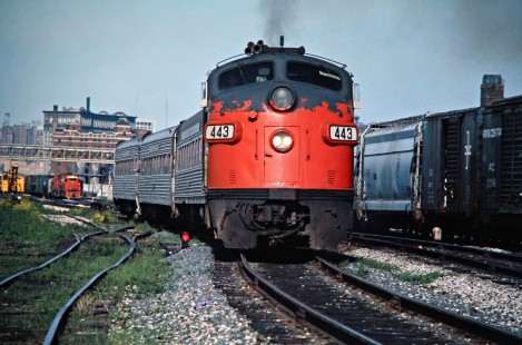 Westbound Amtrak passenger train no. 373, <i>Michigan Executive</i> on Conrail track and westbound Detroit, Toledo and Ironton Railroad freight train (far left) in Detroit, Michigan, on June 2, 1976. Photograph by John F. Bjorklund, © 2016, Center for Railroad Photography and Art. Bjorklund-80-07-10