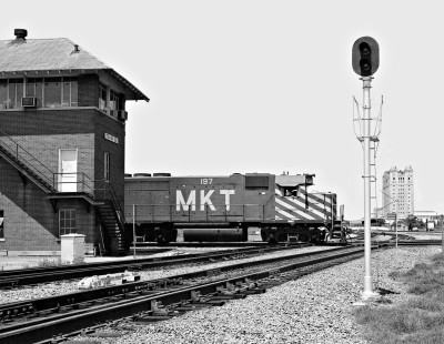 Northbound Missouri–Kansas–Texas Railroad freight train passes Tower 55 in Fort Worth, Texas (former Texas and Pacific Railway headquarter building in background) in April 1973. Photograph by J. Parker Lamb, © 2016, Center for Railroad Photography and Art. Lamb-02-045-06