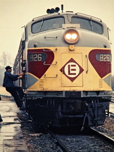 Crew member climbing aboard Erie Lackawanna Railway locomotive no. 826 at Huntington, Indiana, on October 22, 1972. Photograph by John F. Bjorklund, © 2016, Center for Railroad Photography and Art. Bjorklund-54-07-20