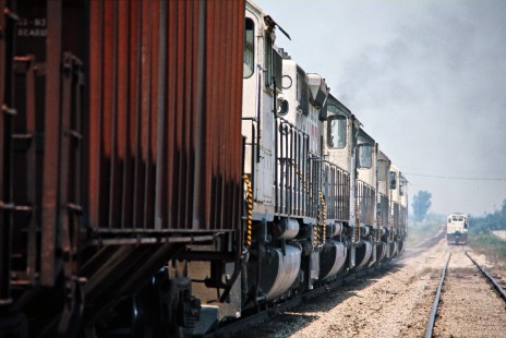 Northbound and southbound Kansas City Southern Railway freight trains meet in Ashbury, Missouri, on July 16, 1977. Photograph by John F. Bjorklund, © 2016, Center for Railroad Photography and Art. Bjorklund-61-03-13