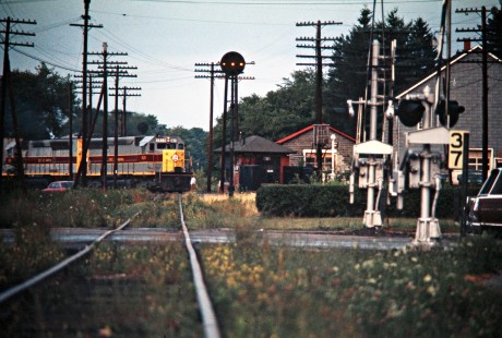 Westbound Erie Lackawanna Railway freight train crossing Penn Central Railroad at Corry, Pennsylvania, on July 19, 1975. Photograph by John F. Bjorklund, © 2016, Center for Railroad Photography and Art. Bjorklund-55-02-11