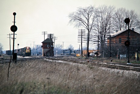 Eastbound Conrail freight train led by Erie Lackawanna Railway power passing a Baltimore and Ohio freight train at Sterling, Ohio, on April 3, 1976. Photograph by John F. Bjorklund, © 2016, Center for Railroad Photography and Art. Bjorklund-56-03-16