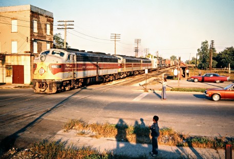Westbound Erie Lackawanna Railway freight train crossing road in Lima, Ohio, on September 28, 1975. Photograph by John F. Bjorklund, © 2016, Center for Railroad Photography and Art. Bjorklund-55-12-23