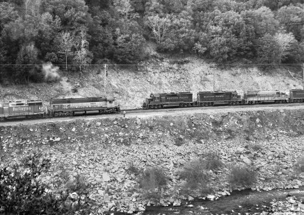 Westbound Western Pacific Railroad freight train passes Burlington Northern Railroad counterpart in Feather River Canyon near Twain, California, in April 1972. Photograph by J. Parker Lamb, © 2017, Center for Railroad Photography and Art. Lamb-02-102-05