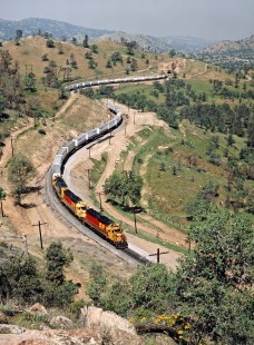 Eastbound Atchison, Topeka and Santa Fe freight train on Southern Pacific Railroad track in Marcel, California, on April 14, 1989. Photograph by John F. Bjorklund, © 2016, Center for Railroad Photography and Art. Bjorklund-87-24-15