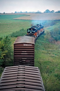 Westbound Milwaukee Road freight train in Spring Valley, Minnesota, on September 29, 1977. Photograph by John F. Bjorklund, © 2016, Center for Railroad Photography and Art. Bjorklund-65-19-04