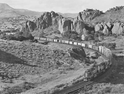Westbound Southern Pacific Railroad intermodal train climbs toward Paisano summit in early morning at Alpine, Texas, in September 1987. Photograph by J. Parker Lamb, © 2017, Center for Railroad Photography and Art. Lamb-02-087-01