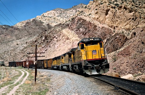 Westbound Union Pacific Railroad freight train in Meadow Valley near Leith, Nevada, on April 10, 1989. Photograph by John F. Bjorklund, © 2016, Center for Railroad Photography and Art. Bjorklund-91-27-17