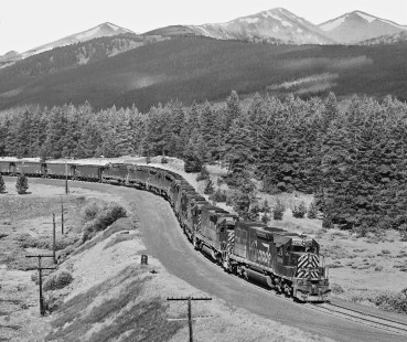 Westbound Denver and Rio Grande Western Railroad coal empties, led by eight units (some helpers), negotiates S-curve near Mitchell siding in July 1980. Photograph by J. Parker Lamb, © 2017, Center for Railroad Photography and Art. Lamb-02-096-12