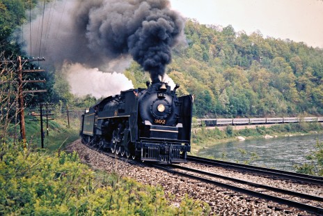 Erie Lackawanna Railway led by Delaware and Hudson steam locomotive no. 302 (Reading no. 2102 in disguise) passes the Delaware River at Hankins, New York, on May 25, 1973. Photograph by John F. Bjorklund, © 2016, Center for Railroad Photography and Art. Bjorklund-54-12-19
