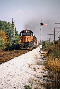 Southbound Milwaukee Road freight train in Orleans, Indiana, on October 13, 1985. Photograph by John F. Bjorklund, © 2016, Center for Railroad Photography and Art. Bjorklund-69-13-10