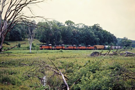 Westbound Milwaukee Road freight train in Harmony, Minnesota, on July 20, 1976. Photograph by John F. Bjorklund, © 2016, Center for Railroad Photography and Art. Bjorklund-65-08-01