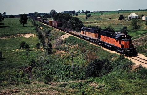 Eastbound Milwaukee Road freight train near Mystic, Iowa, on July 11, 1981. Photograph by John F. Bjorklund, © 2016, Center for Railroad Photography and Art. Bjorklund-69-02-17
