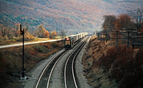 Westbound Erie Lackawanna Railway freight train in Canaseraga, New York, on October 20, 1974. Photograph by John F. Bjorklund, © 2016, Center for Railroad Photography and Art. Bjorklund-54-27-02