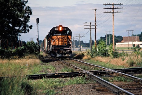 Southbound Milwaukee Road freight train on Burlington Northern track at Bald Eagle, Minnesota, on August 8, 1982. Photograph by John F. Bjorklund, © 2016, Center for Railroad Photography and Art. Bjorklund-69-07-05