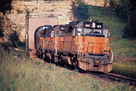 Westbound Milwaukee Road freight train in Tunnel City, Wisconsin, on July 5, 1975. Photograph by John F. Bjorklund, © 2016, Center for Railroad Photography and Art. Bjorklund-64-26-04