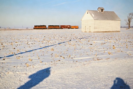 Southbound Milwaukee Road freight train in Scarboro, Illinois, on January 22, 1977. Photograph by John F. Bjorklund, © 2016, Center for Railroad Photography and Art. Bjorklund-65-11-03