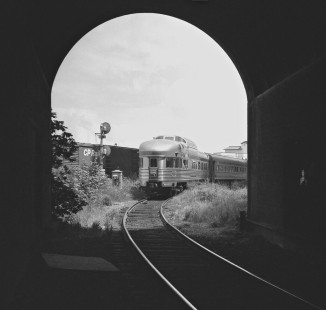 Framed by tunnel, observation car of Canadian Pacific Railway's <i>Canadian</i> passenger train heads to Vancouver, British Columbia, waterfront station after train was wyed at freight yard in June 1978. Photograph by J. Parker Lamb, © 2017, Center for Railroad Photography and Art. Lamb-02-111-09