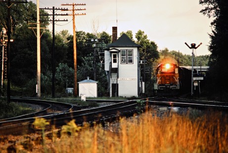 Westbound Milwaukee Road freight train crossing Burlington Northern track at St. Croix Tower, Minnesota, on August 8, 1982. Photograph by John F. Bjorklund, © 2016, Center for Railroad Photography and Art. Bjorklund-69-08-18