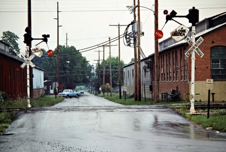 Former Erie Lackawanna Railway crossing signals protecting a Conrail line at Kenton, Ohio, on June 15, 1985. Photograph by John F. Bjorklund, © 2016, Center for Railroad Photography and Art. Bjorklund-55-30-01