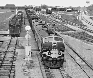 Houston-bound Atchison, Topeka and Santa Fe Railway freight train departs yard in Temple, Texas, in December 1954. Note passenger by-pass line to right. Photograph by J. Parker Lamb, © 2016, Center for Railroad Photography and Art. Lamb-02-066-06