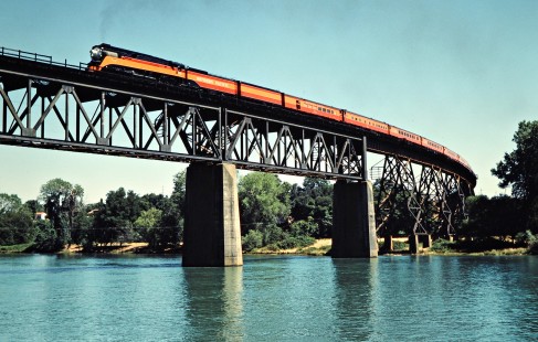 Eastbound Southern Pacific Railroad passenger train, <i>Daylight</i>, led by steam locomotive no. 4449 crossing Sacramento River in Redding, California, on June 23, 1984. Photograph by John F. Bjorklund, © 2016, Center for Railroad Photography and Art. Bjorklund-86-22-22