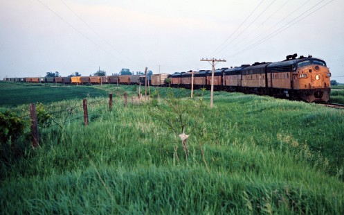 Westbound Milwaukee Road freight train in Calmar, Iowa, on May 28, 1977. Photograph by John F. Bjorklund, © 2016, Center for Railroad Photography and Art. Bjorklund-65-17-18