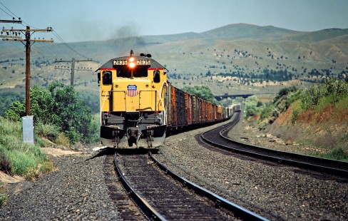 Eastbound Union Pacific Railroad freight train in Durkee, Oregon, on June 28, 1984. Photograph by John F. Bjorklund, © 2016, Center for Railroad Photography and Art. Bjorklund-90-10-22