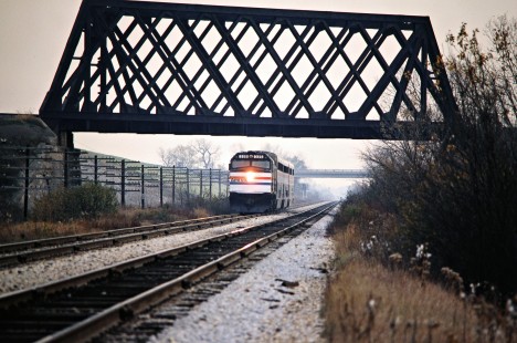 An abbreviated version of westbound Amtrak passenger train no. 7, the <i>Empire Builder</i>, on Milwaukee Road track at Techny, Illinois, on October 31, 1981. Photograph by John F. Bjorklund, © 2016, Center for Railroad Photography and Art. Bjorklund-69-04-08