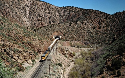 Westbound Union Pacific Railroad freight train at Clover Creek in Islen, Nevada, on April 9, 1989. Photograph by John F. Bjorklund, © 2016, Center for Railroad Photography and Art. Bjorklund-91-24-12
