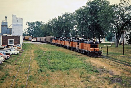 Eastbound Milwaukee Road freight train at Wykoff, Minnesota, on July 19, 1976. Photograph by John F. Bjorklund, © 2016, Center for Railroad Photography and Art. Bjorklund-65-05-01