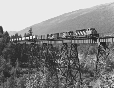 Eastbound Canadian National Railway Trailer On Flat Car freight train crosses bridge north of Boston Bar, British Columbia, in June 1978. Photograph by J. Parker Lamb, © 2017, Center for Railroad Photography and Art. Lamb-02-113-11