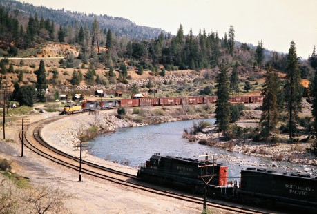 Westbound and eastbound Southern Pacific Railroad freight trains meet in Lamoine, California, on April 22, 1975. Photograph by John F. Bjorklund, © 2016, Center for Railroad Photography and Art. Bjorklund-84-16-11