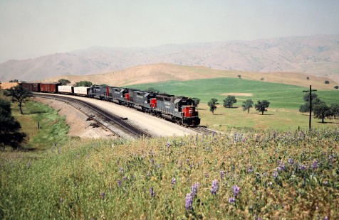 Eastbound Southern Pacific Railroad freight train in Bealville, California, on April 14, 1989. Photograph by John F. Bjorklund, © 2016, Center for Railroad Photography and Art. Bjorklund-87-25-06